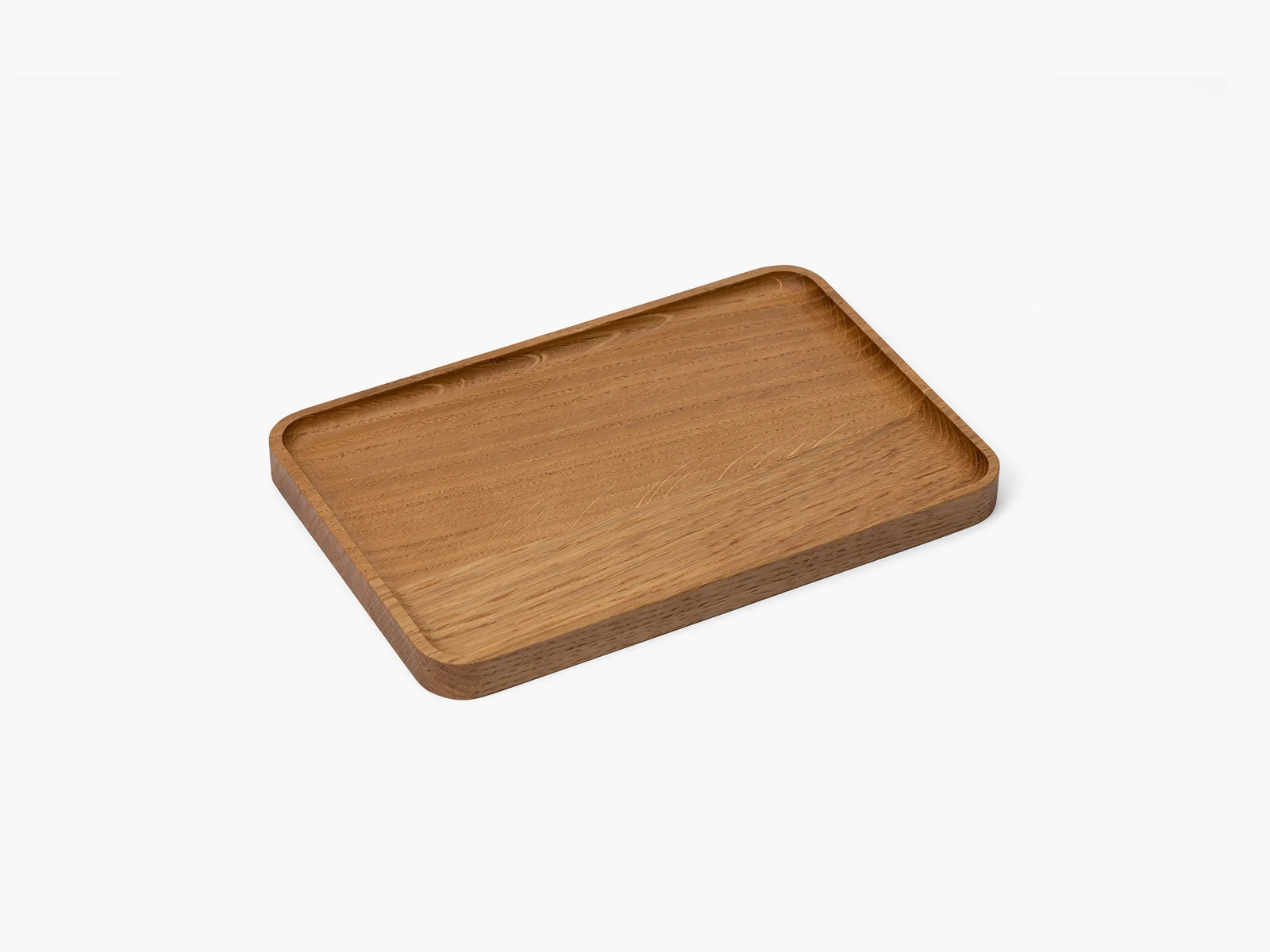 Wooden oak catchall tray on a white background.