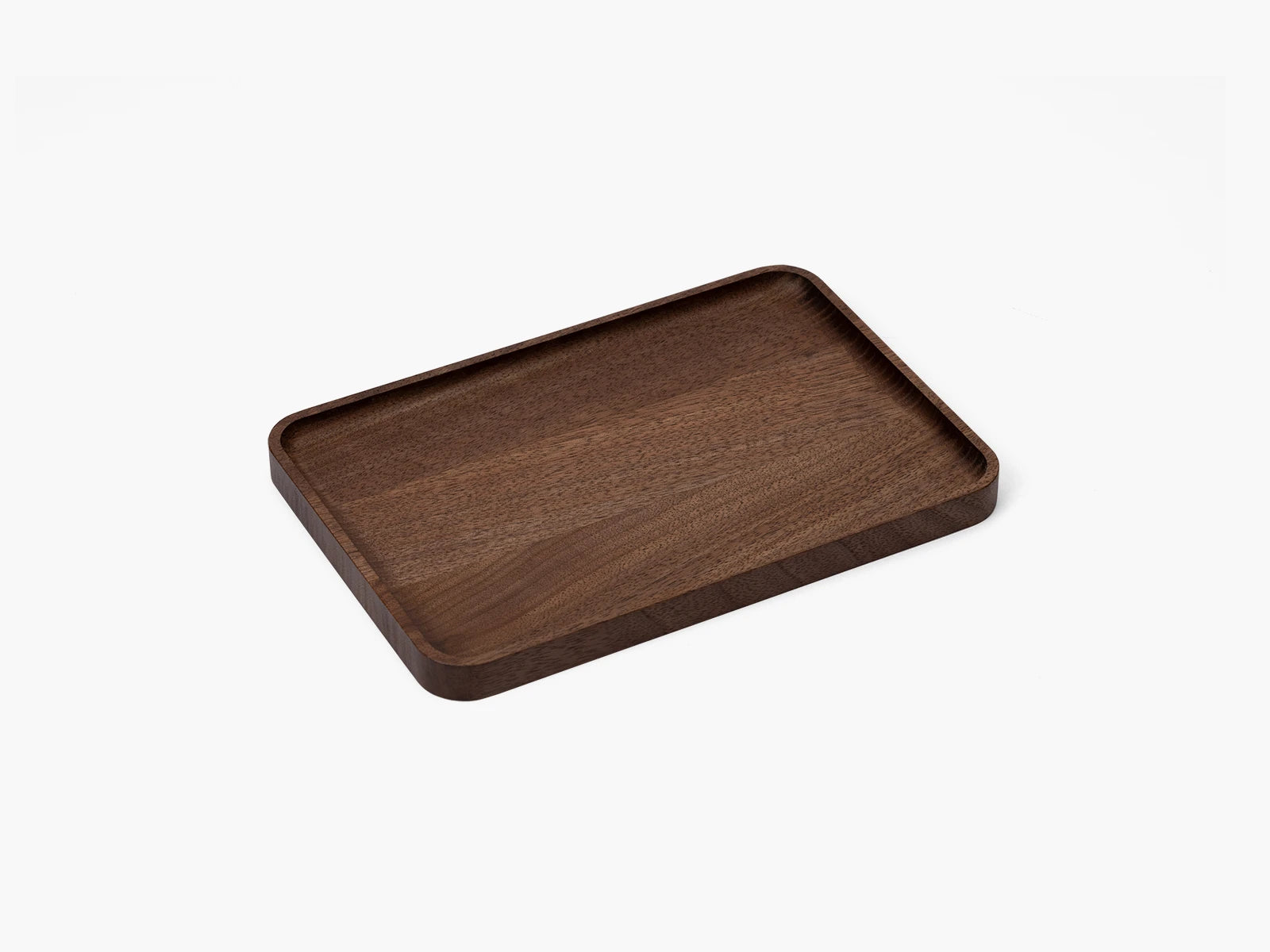 Wooden walnut catchall tray on a white background.
