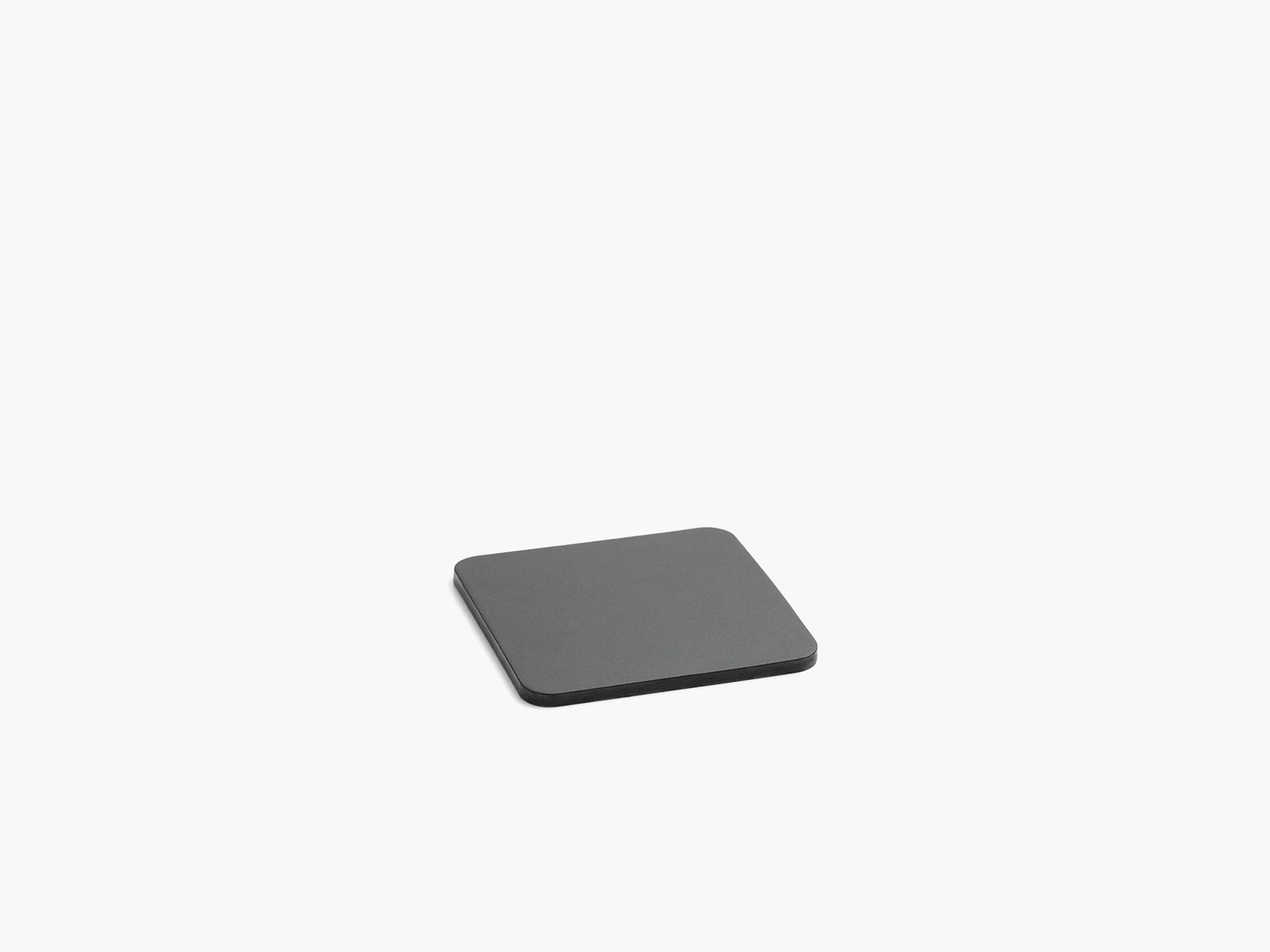 Black leather square coaster on a white background.